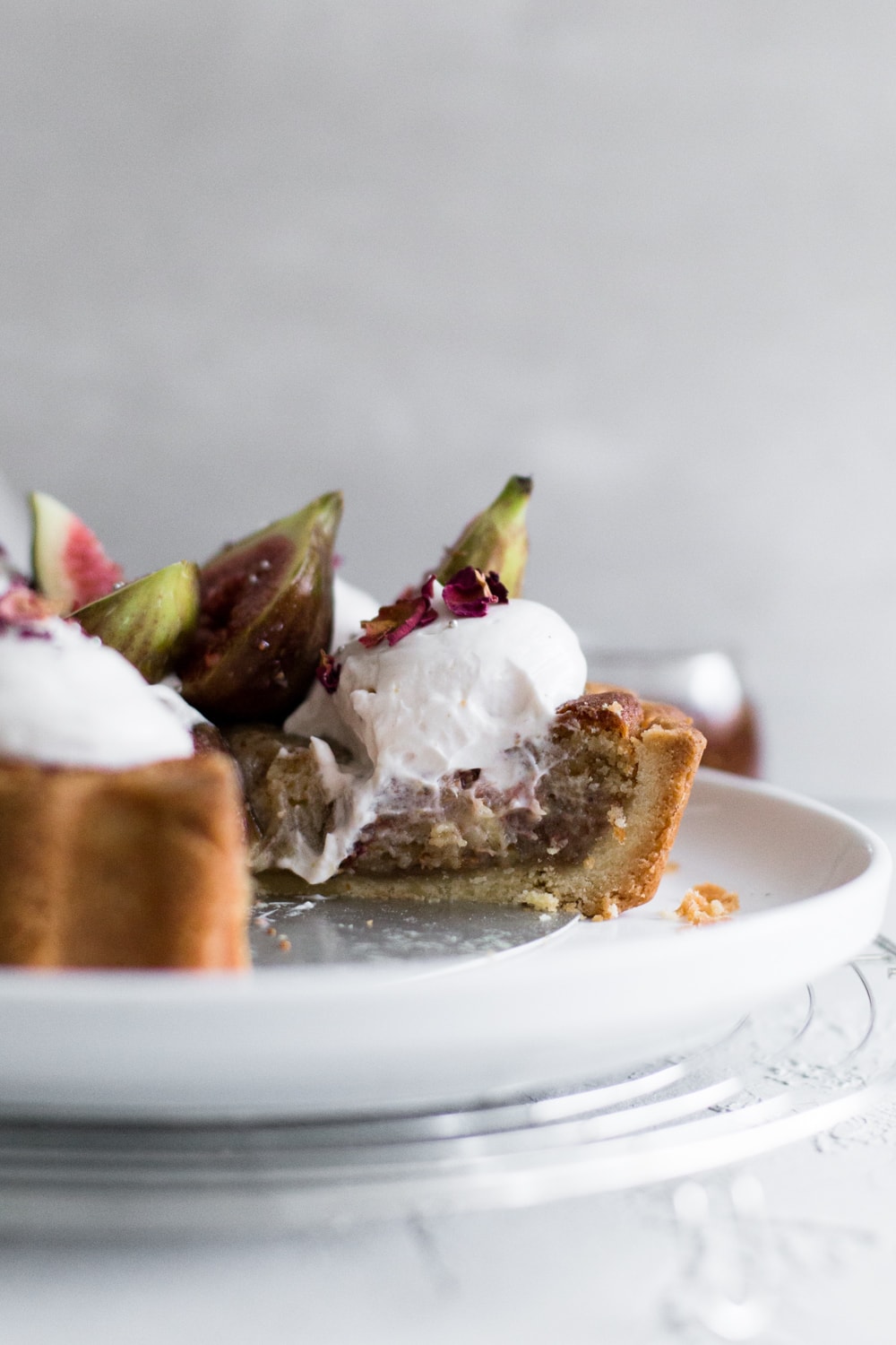 A delicious Vegan Fig Tart with a sweet pastry crust filled with Fig Jam, Vegan Almond Frangipane and topped with Vegan Whipped Cream. #fig #tart #vegan #almond #frangipane #fruittart #dairyfree #simple #easy #plantbased #almondpaste