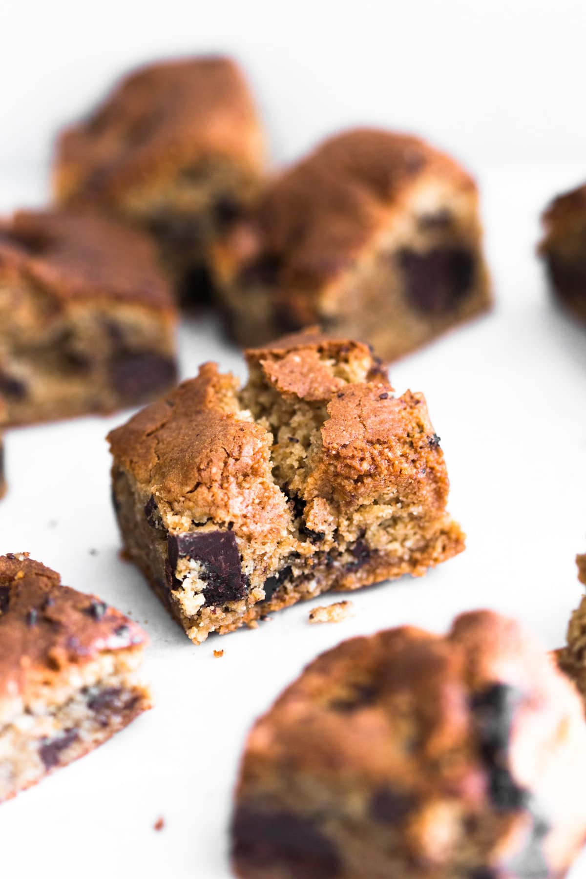 Sweet meets salty in these Vegan Miso Chocolate Chip Cookie Bars. Don't knock it till you try it! Ready in under an hour and 100% Gluten Free. #miso #glutenfree #chocolatechip #blondies #chocolatechunk #misochocolate #salty #baking #vegan #cookiebar #almonds #dairyfree