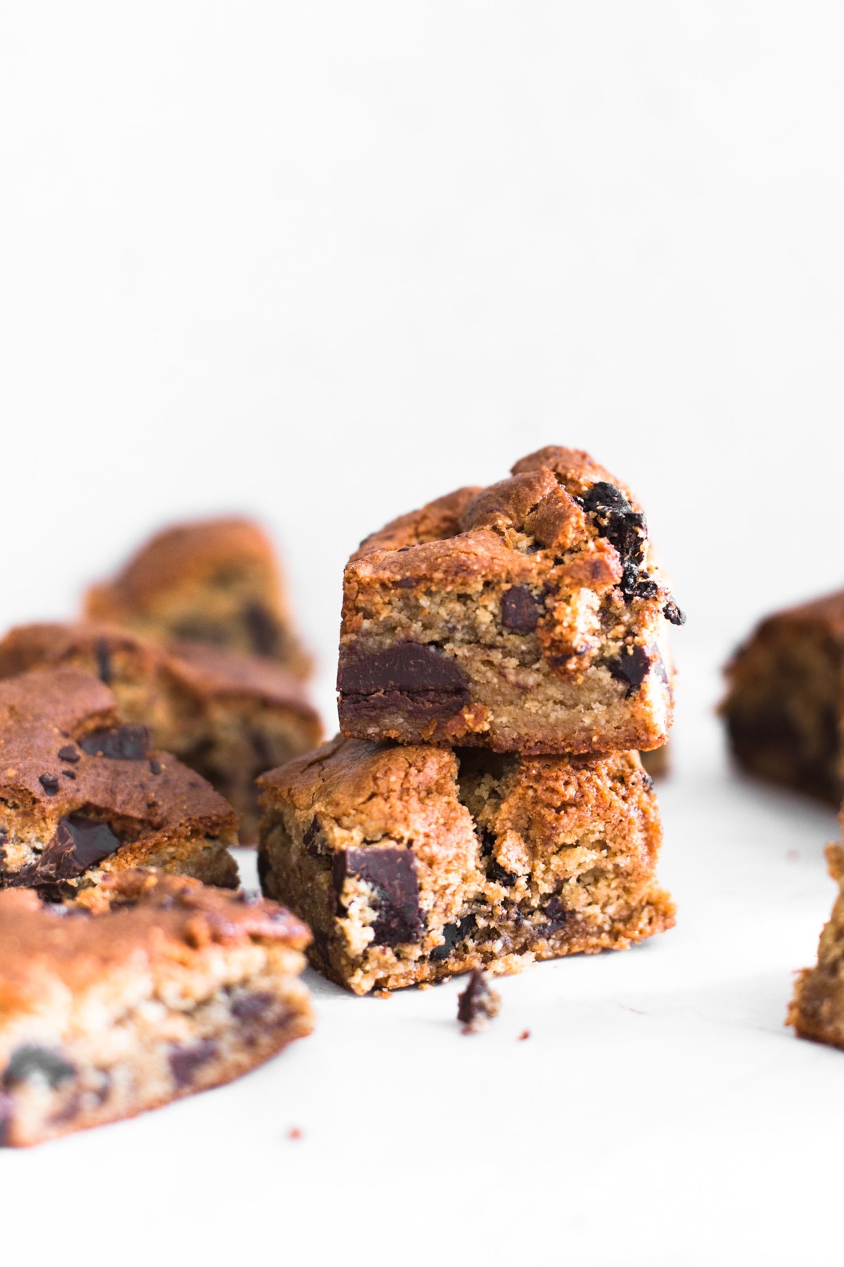 Sweet meets salty in these Vegan Miso Chocolate Chip Cookie Bars. Don't knock it till you try it! Ready in under an hour and 100% Gluten Free. #miso #glutenfree #chocolatechip #blondies #chocolatechunk #misochocolate #salty #baking #vegan #cookiebar #almonds #dairyfree
